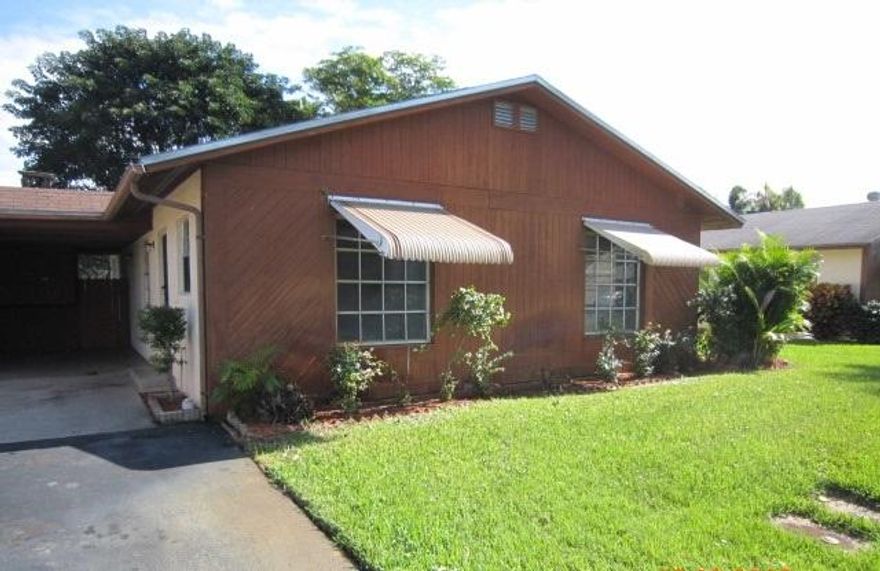 Great East Boynton Beach location.  This 2 bedroom, 2 baths 1 story villa has everything at you need to call home.  Located in the community of Los Mangos in Boynton Beach. Under cover carport with storage space, Washer & dryer utility room.   Well maintained grounds with landscaping and trees galore for that perfect garden setting. Split bedrooms, nice sized main suite with separate walk-in shower, vanity sink and walk-in closet space.  Guest bathroom has tub/shower combo. Open floor plan makes unit seem larger than square footage.   Kitchen has tile flooring, dark cabinets, Formica countertops, tile backsplash and lots of cabinet space.  Carpeted bedrooms.  Close to schools, shopping and fine dining.  Just 10 minutes to downtown Delray Beach. 2 Community pools.