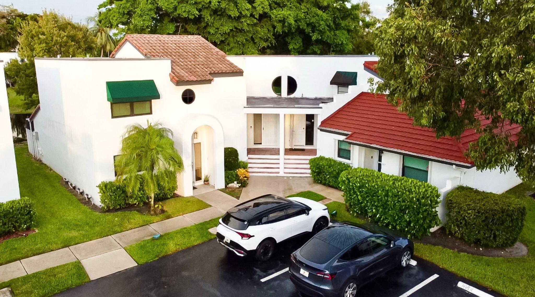 Discover this fully renovated waterfront townhome in the heart of Deerfield Beach! This 2-bedroom, 2.5-bathroom residence blends modern design with peaceful canal views, offering both comfort and style.Step inside to an open-concept living space filled with natural light, featuring wood-look tile floors and fresh designer touches throughout. The updated kitchen boasts white shaker cabinets, granite countertops, stainless steel appliances, and breakfast bar seating--perfect for both daily living and entertaining.The spacious primary suite offers a relaxing retreat with a beautifully remodeled ensuite, while additional bedrooms provide versatility for guests, family, or a home office.