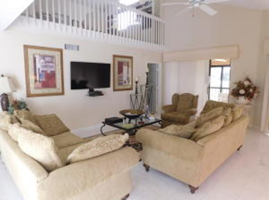 Price just Reduced!! Two story loft unit with double fairway views on magnificent Legends Golf Course within Gleneagles Country Club.
This immaculate property is move-in ready. Newer A/C, washer and dryer. Hurricane Shutters, marble floors,french doors in dining room. Can be bought furnished or unfurnished. Must See! Walk to Club.Country Club membership required.