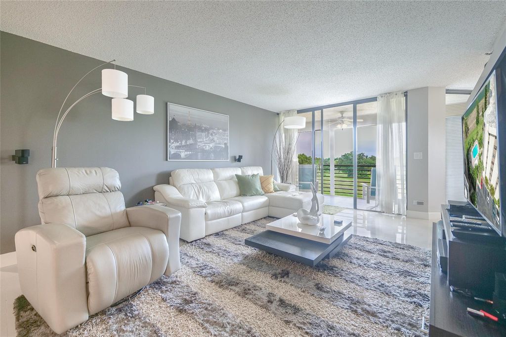 Photo of 7300 Radice Court #303, Lauderhill, FL 33319 (MLS # B26003452)