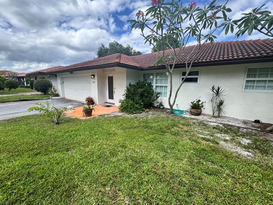 A fantastic location in a well-manicured community. This large 2 bedroom, 2 bathroom home features a front living room, enclosed back living area as well as a dining and breakfast area off of the kitchen. The kitchen is the heart of the home and it open to all living spaces. The primary bedroom has a walk in closet, dressing area and separate bathroom. Enjoy the large grassy yard that is a wonderful place to gather, play and celebrate. The home has a spacious 2 car garage, hurricane impact windows and doors, tile roof and gutters. Property has prime location across from the clubhouse with a vast green space between it. With and HOA fee of just $250 per month. Renting okay 1 time per year. Pets welcome.  Pets okay, Lease once a year, this is a 55+ Community and no children under 18 Minimum credit 700 +.  Background check and personal interview also required