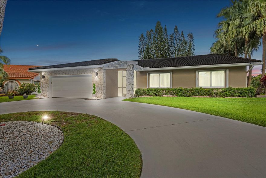 Beautifully updated home featuring new flooring and high-end wood vaulted ceilings. Impact windows and doors, updated baseboards, and energy-efficient LED lighting throughout. Spacious master suite overlooks the pool and includes a luxurious bath with bidet. Kitchen offers ample space with wood cabinets. Updated half bath, very cold and efficient A/C, home vacuum. Enjoy stunning water views from the large backyard—perfect for entertaining. Accordion shutters , impact windows, offering storm protection and modern appeal, low HOA—move-in ready and built for comfort!- Seller may consider buyer concessions if made in an offer.