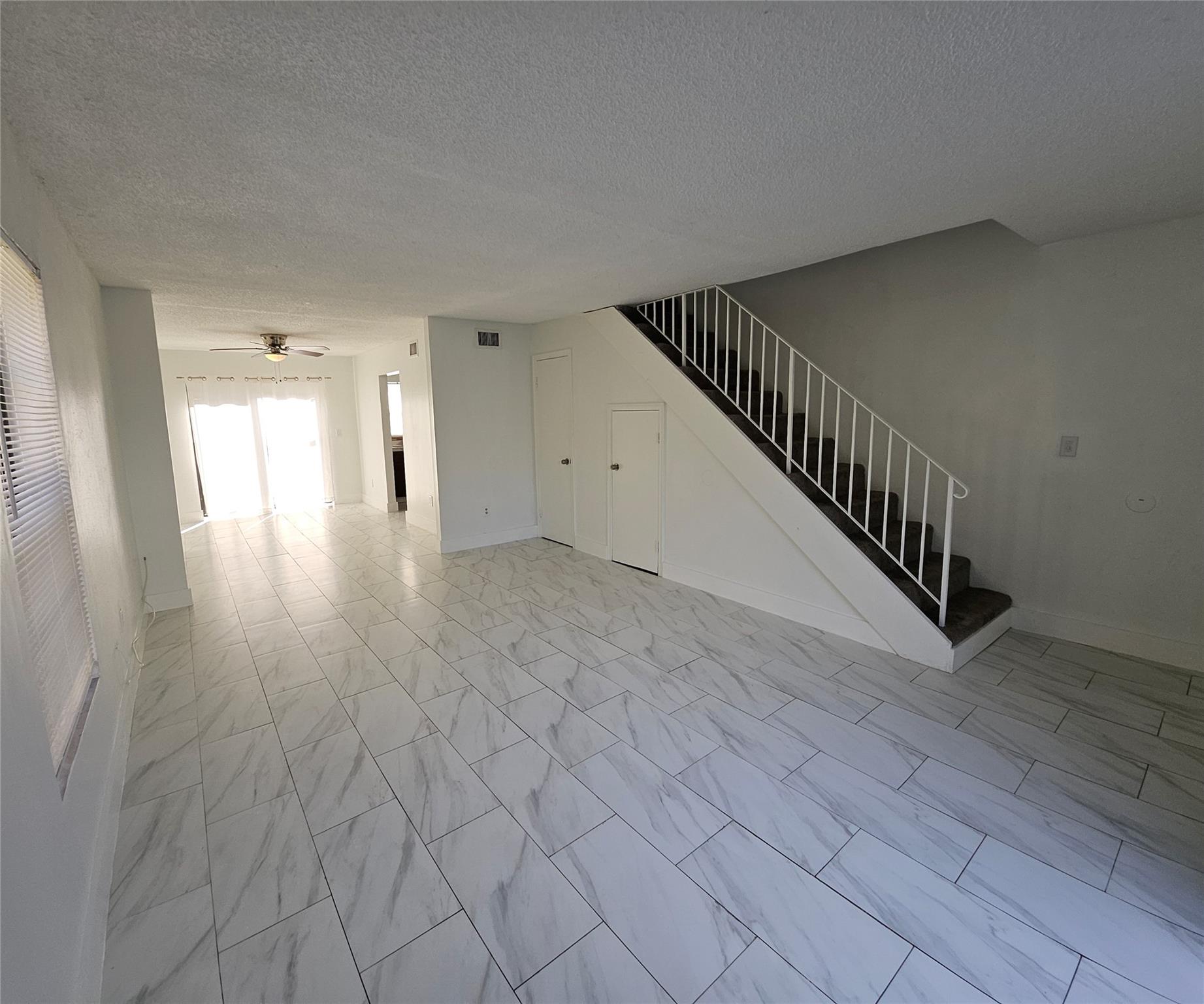 Updated two-bedroom, 1.5-bath townhouse. Community pool, all bedrooms on the second floor, flooring, updated kitchen and bathrooms, front-load washer and dryer, and a private, fenced patio. Water included. The condo application required takes about 30 days
