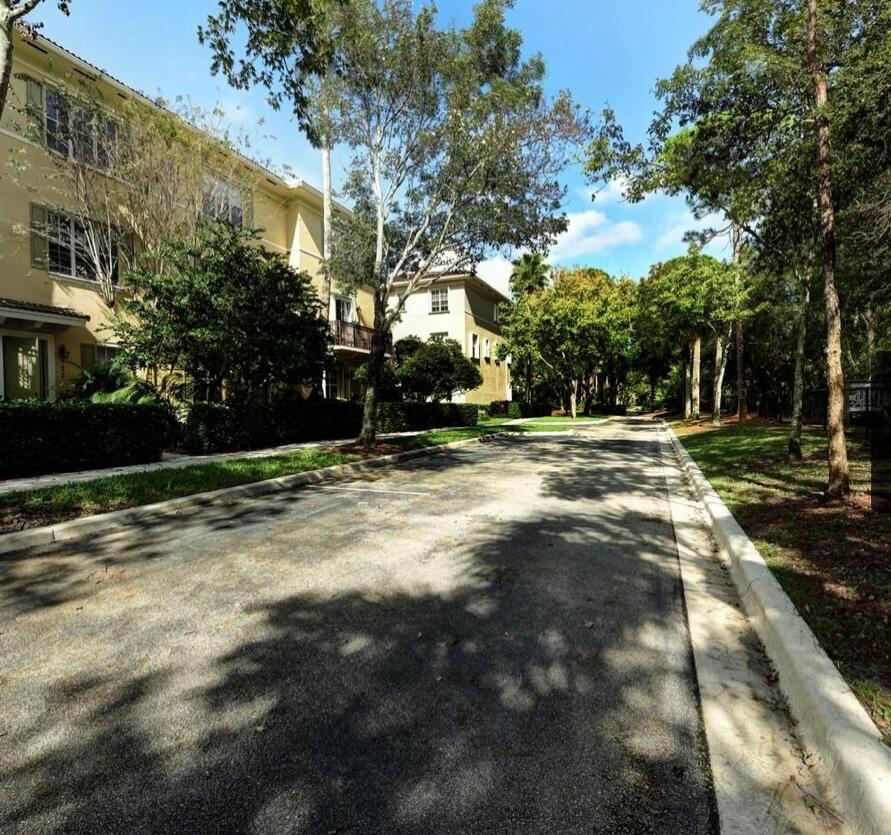 Located in the highly sought-after Abacoa in Osceola Woods. This unit is right across from the entrance into the preserve and a few feet to the community pool. Quick walk or bike to Starbucks and Publix at Abacoa Plaza! This three story townhome has 3 Bedrooms, Den, 3.5 Baths, and a 2 car garage. Almost 1,900 sq. ft. under air. New flooring throughout and carpeted staircases and the third-floor landing, alongside a fresh paint job. Recent upgrades includes a new Ring doorbell, a quiet garage door opener, updated appliances, and a new washer and dryer. High ceilings throughout. Walk to downtown Abacoa, restaurants, stadium and ball fields. Just a few minutes drive to both I-95 and the Turnpike.
