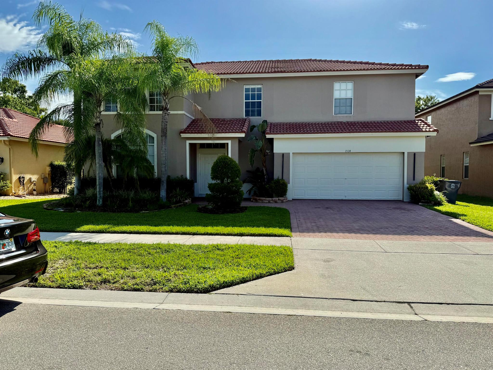 This newly renovated 4-bed, 2.5-bath home is located in a secure, family-oriented gated community. Featuring luxury finishes and modern updates throughout, this turn-key property offers both style and comfort. Inside, the kitchen is a true showstopper, boasting an oversized white quartz waterfall island with custom cabinetry, perfect for entertaining or casual dining. The kitchen is outfitted with high-end Viking appliances, including a gas stove with hood and a premium refrigerator. Additional fridge space is available in the garage. The open-concept living areas include elegant porcelain tile floors downstairs, gorgeous lighting fixtures in the living room and stairwell, and a custom-built, glass-enclosed wine rack set into the wall. The upstairs features four spacious bedrooms all