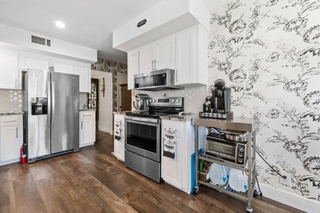 Photo of 13864 Whispering Lakes Lane, Palm Beach Gardens, FL 33418 (MLS # R10846862)