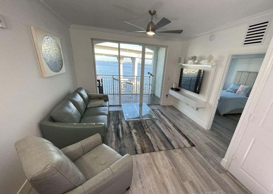 Waterfront Living at Its Finest! This stunning 2-bedroom, 2-bath condo offers breathtaking views of the St. Lucie River from your private balcony. Located on the 4th floor, this unit features a modern design with vinyl & tile flooring throughout, granite kitchen countertops, & washer/dryer for added convenience. The spacious master suite includes a walk-in shower, a soaking tub, & ample closet space, while the second bedroom is equally inviting. Water, Cable & Internet Included. Enjoy included resort-style amenities: Two heated pools, hot tub, sauna, fitnesscenter, clubhouse with planned social activities, poolside cafe & bar, TideHouse Restaurant on-site, Full-service marina with potential dockage foryachts up to 100'. All located just a short walk or bike ride from downtown Stuart.