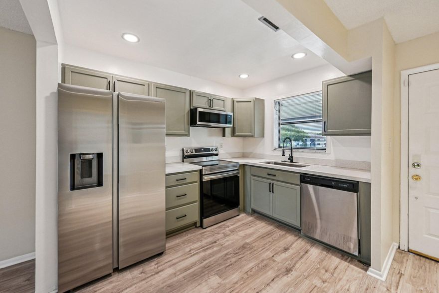 Welcome to 6001 Shakerwood Circle #203 —this beautifully updated 2-bedroom, 2-bath condo is completely move-in ready. Features include fresh paint, stainless steel energy-efficient appliances, a newer A/C, and a brand-new stacked washer and dryer. The bathrooms have been fully redone with modern finishes, and a spacious private balcony offers the perfect place to relax. Smart home features add convenience and efficiency.  Ideally located near Waters Edge Park and Colony West Golf Club, with easy access to shopping, dining, and major roadways. A perfect turnkey opportunity for homeowners or investors.