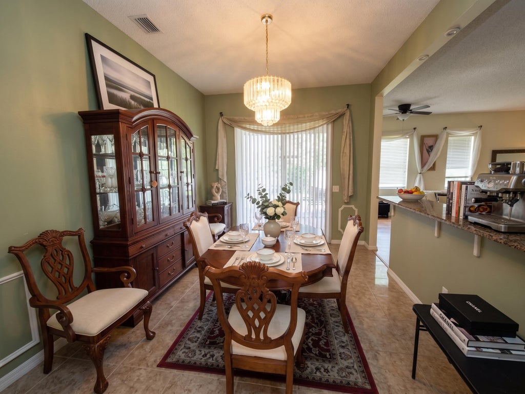 Photo of 561 SE Walters Terrace, Port Saint Lucie, FL 34983 (MLS # B26079219)