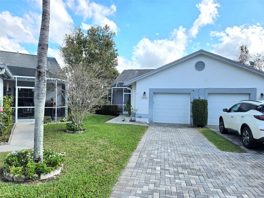 WELCOME TO THIS BEAUTIFUL AND RARELY AVAILABLE VILLA IN WATERS EDGE - AN INTIMATE COMMUNITY IN TAMARAC. AS YOU APPROACH, YOU'LL BE GREETED BY A LONG PAVER DRIVEWAY LEADING TO A SPACIOUS GARAGE AND A LARGE FRONT PATIO. STEP INSIDE AND EXPERIENCE THE GRANDEUR OF VAULTED CEILINGS, GRANITE COUNTER TOPS IN THE LARGE EAT-IN KITCHEN WHICH OVERLOOKS THE DINING AND LIVING ROOM. FROM THERE YOU HAVE A BEAUTIFUL VIEW OF THE LARGE BACK PATIO WHICH LOOKS OUT AT THE WATER. SPLIT BEDROOMS, ACCORDIAN SHUTTERS, ATTIC STORAGE AND MORE. THIS HOME HAS BEEN WELL-MAINTAINED. DRIVEWAY CAN FIT 2 CARS. COMMUNITY POOL.