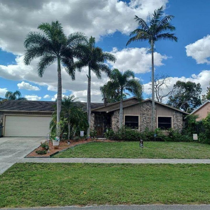 Well Maintained 3 bedroom 2 bath home ~ Updated kitchen, with 42'' wood cabinets ~ Corrian counters ~ SS Appliances ~ Nice wood pergo flooring throughout main living and master bedroom ~Inside laundry room with tons of storage, ~ Covered screened patio leading to a large tropical fenced yard with above ground pool and deck. ~ 2 car garage with egress door ~ 30 & 50 amp power to plug your RV ~ New Roof 2012 ~ New A/C 2017