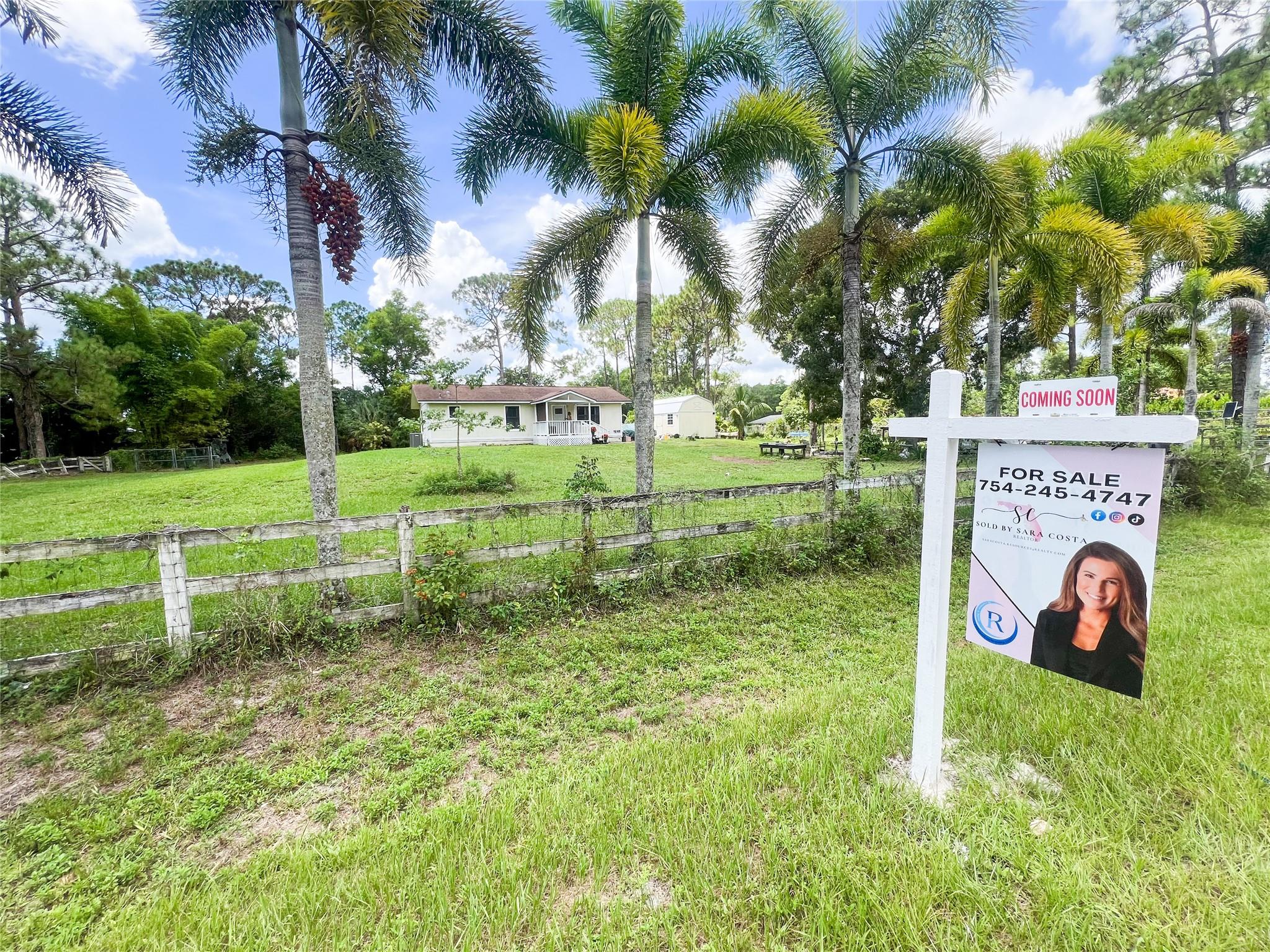Welcome to your own private homestead oasis on 1.33 acres! This updated & charming 2/2 home blends comfort with sustainable living. Enjoy hurricane impact windows & doors, a newer A/C, new tankless water heater and a Tesla panel. The open layout provides comfortable living space, while the yard offers endless possibilities for gardening, expansion, or simply enjoying the peaceful surroundings. Tucked away in a serene, natural setting, enjoy raising chickens in a custom coop, quails in a separate enclosure, fish in the pond & harvest fruit from the many fruit trees. ! A large 12x24 hurricane-rated shed adds storage, & there’s plenty of space for RVs, boats, or expansion—no HOA—Property is at the end of the street for ultimate privacy. This property offers it all! Your rural retreat awaits!