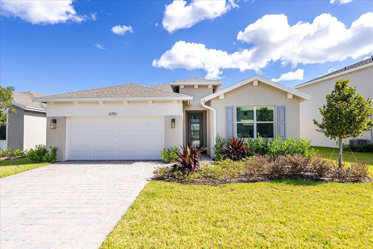 Welcome to the tranquil and gated community of Preserves at Park Trace in the heart of Stuart, Florida. This home boasts a scenic view backing up to a serene pond, offering a peaceful retreat. Relax at your community pool and cabana, ideal for unwinding under the Florida sun or mingling with neighbors. Luxury living with features like waterfall kitchen islands, soft-close cabinetry, porcelain tile flooring, impact glass windows and sliders, frameless shower enclosures, and more.