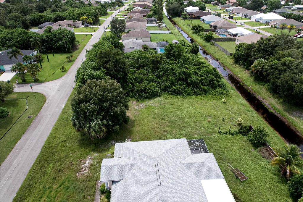 Photo of 321 SW Feldman Avenue, Port Saint Lucie, FL 34953 (MLS # R11019577)