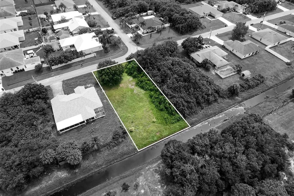 Photo of 321 SW Feldman Avenue, Port Saint Lucie, FL 34953 (MLS # R11019577)