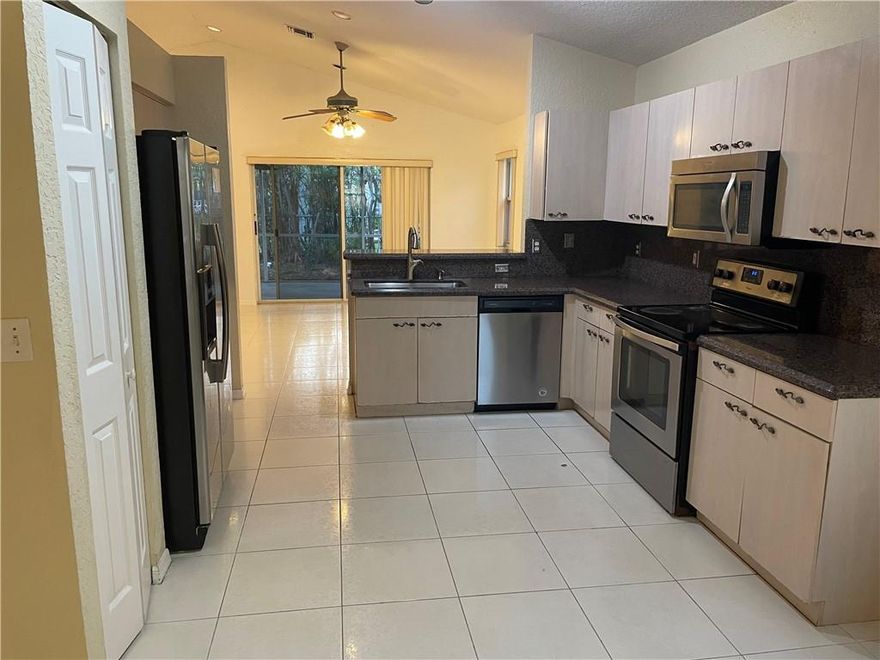 Desirable Mission Bay's community of Harbour Springs. Super 3 bed, 2 bath, 2 car garage, extra large driveway. Modern open floor plan and high ceilings. Granite kitchen, with new stainless steel appliances, new AC. Ready to move in. Covered patio out back. Mission Bay provides resort style living with a community pool and hot tub, sauna, state of the art fitness center, tennis, basketball, playground and much more to enjoy. Conveniently located near A+ rated schools, walking distance to restaurants, shops and parks. This home is perfectly situated to provide you and your family with the safety and amenities for you to enjoy. Schools are Sandpiper Elementary, Loggers Run Middle School, and West Boca Community H.S.