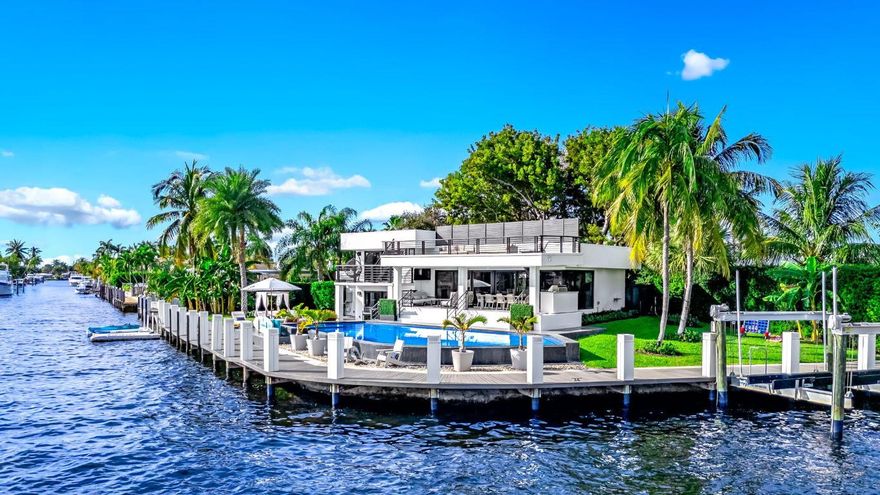 2-4 month seasonal lease. Nestled on a quiet cul-de-sac with every neighbor on the water, this stunning luxury waterfront home offers unparalleled views of the water and intracoastal. With a contemporary design, the open-concept style features modern finishes, expansive windows, and artistic touches throughout. The gourmet kitchen boasts cutting-edge Thermador appliances and an eclectic island, perfect for entertaining. Including a private balcony and roof top terrace, the primary suite showcases an elegant statement shower, blurring the boundaries for traditional bathrooms. Enjoy seamless indoor-outdoor living with a spacious covered patio, infinity pool, and an oversized dock. Bring your yacht or park your fishing boat on the 24,000 lb lift. This is waterfront living at its fines