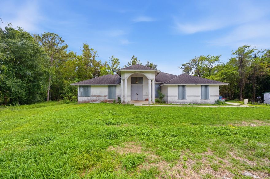 Fix & Flip or Investor Special in Royal Palm Beach! This spacious 5-bedroom, 3-bathroom home with a 2-car garage sits on over an acre and is full of potential. With large square footage, great bones, and a functional layout, this property is the perfect opportunity to renovate, customize, and add serious value. Whether you're searching for your next investment project or ready to create your dream family home, this one is a rare find. Bring your vision and TLC—there's plenty of room for a pool, outdoor living, toys, and more. Endless possibilities in a prime location!