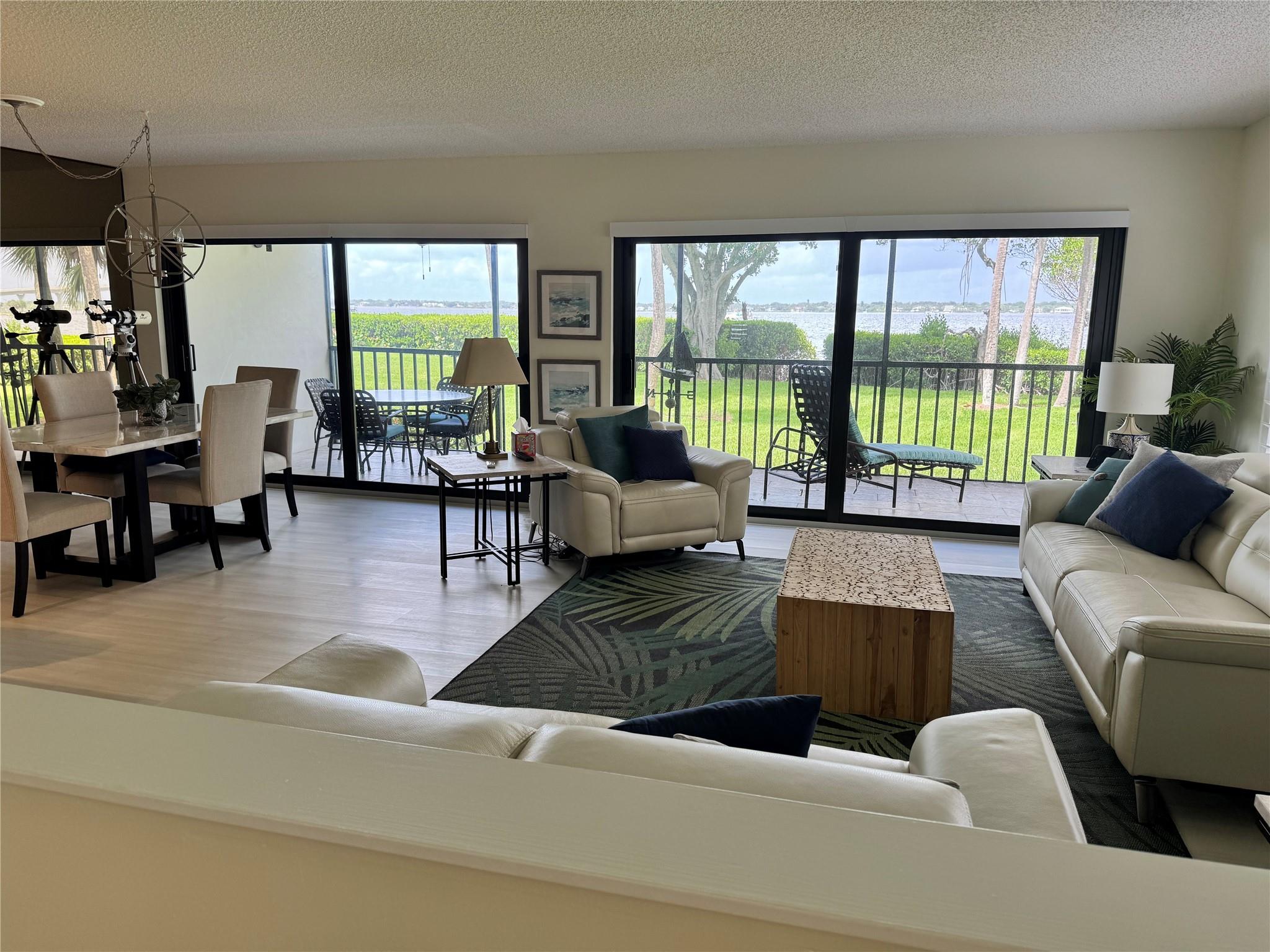 Panoramic Waterfront Living at Riverwood IRP. Experience breathtaking wide-water Intracoastal views from this beautifully updated first-floor corner condo. This light-filled residence offers a spacious open floor plan, with glass sliding glass doors leading to a screened porch ideal to enjoy sunsets. Thoughtfully renovated, this home features full-impact windows and elegant plantation shutters, a modern kitchen with quartz countertops, custom cabinetry, and new Café appliances, new LVP flooring throughout, new w/d, 2025 A/C, motorized blinds on sliders. Step directly from your screened porch to private kayak storage and launch! Condo is available for rent: season $6500/mo for 6 months (Nov-Apr) or Oct 2025 for $2750/mo. Condo also available FOR SALE with potential for Owner Financing.