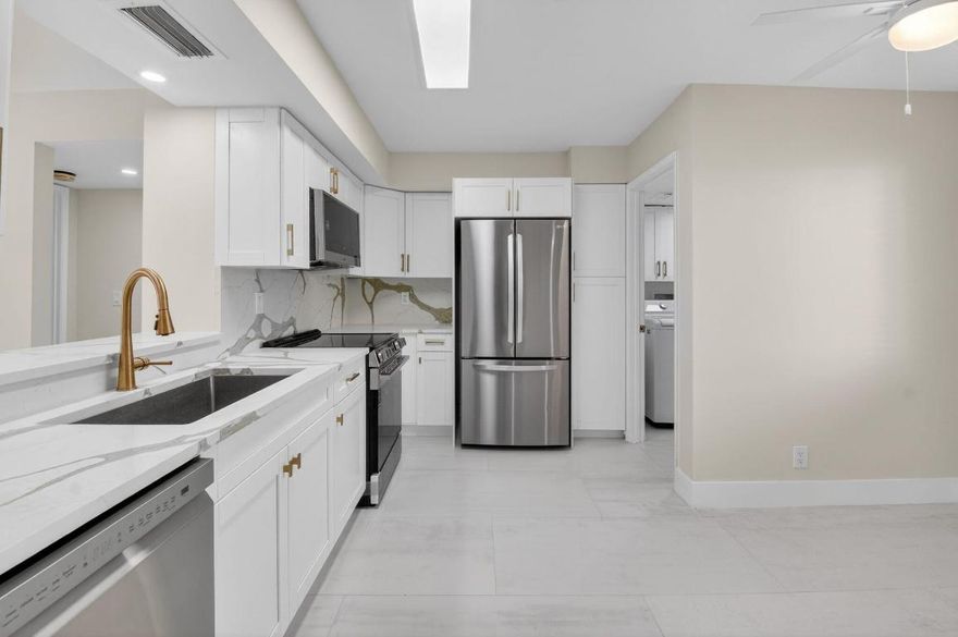 Gorgeous totally renovated move-in ready 2 BR 2 BA first floor unit with carport parking. Enjoy beautiful lake views from your oversized lanai.