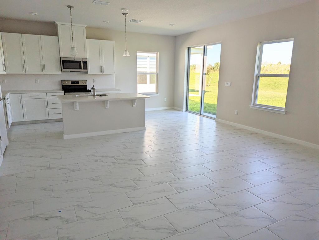 Photo of 10597 SW Vasari Way, Port Saint Lucie, FL 34987 (MLS # B26003936)