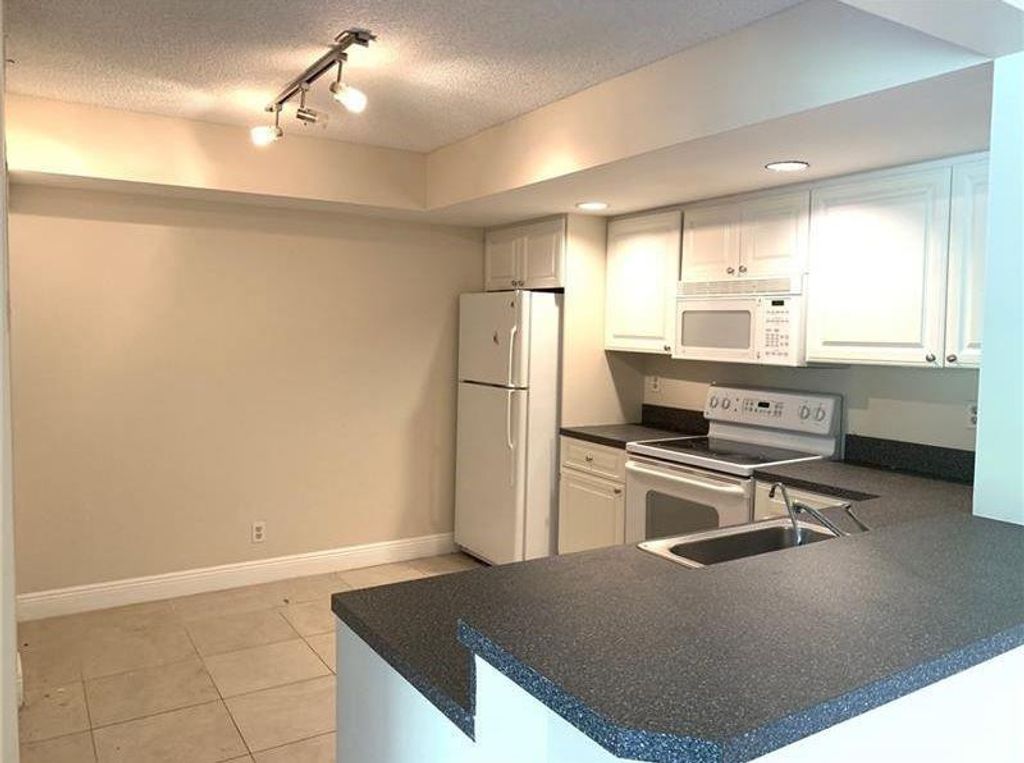 Photo of 5621 Riverside Drive #102, Coral Springs, FL 33067 (MLS # F10482362)