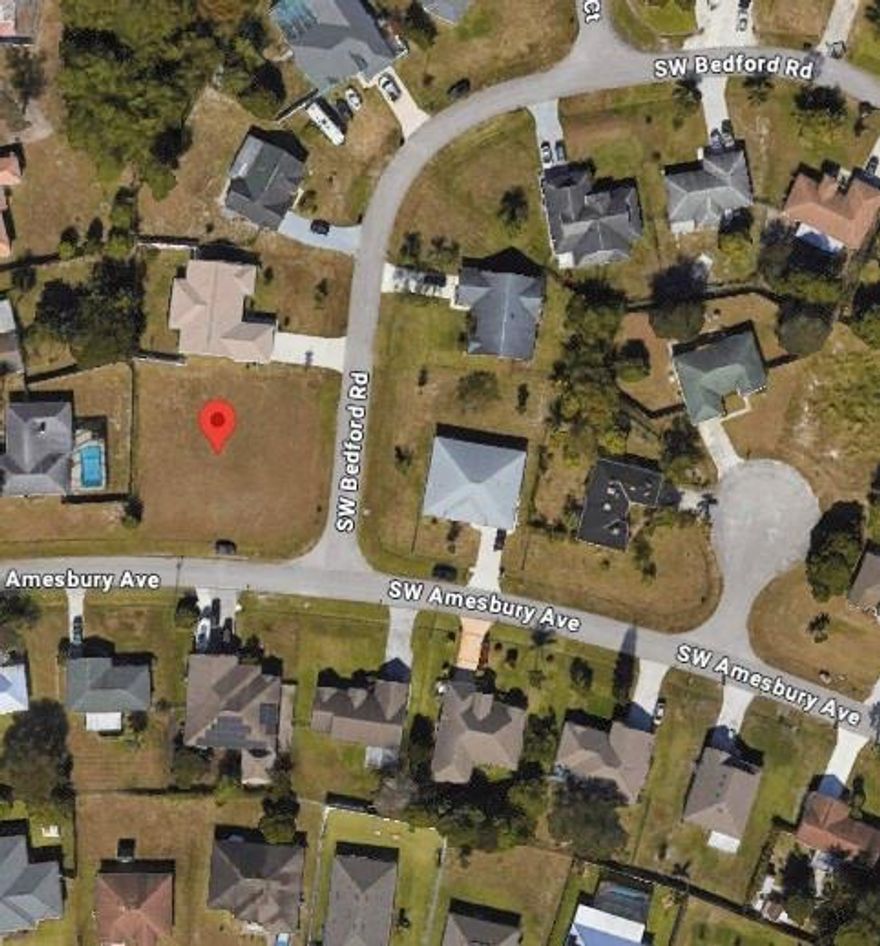 Corner already elevated vacant lot, single residential houses around. no trees, or bushes we have monthly lawn service to keep it clean.