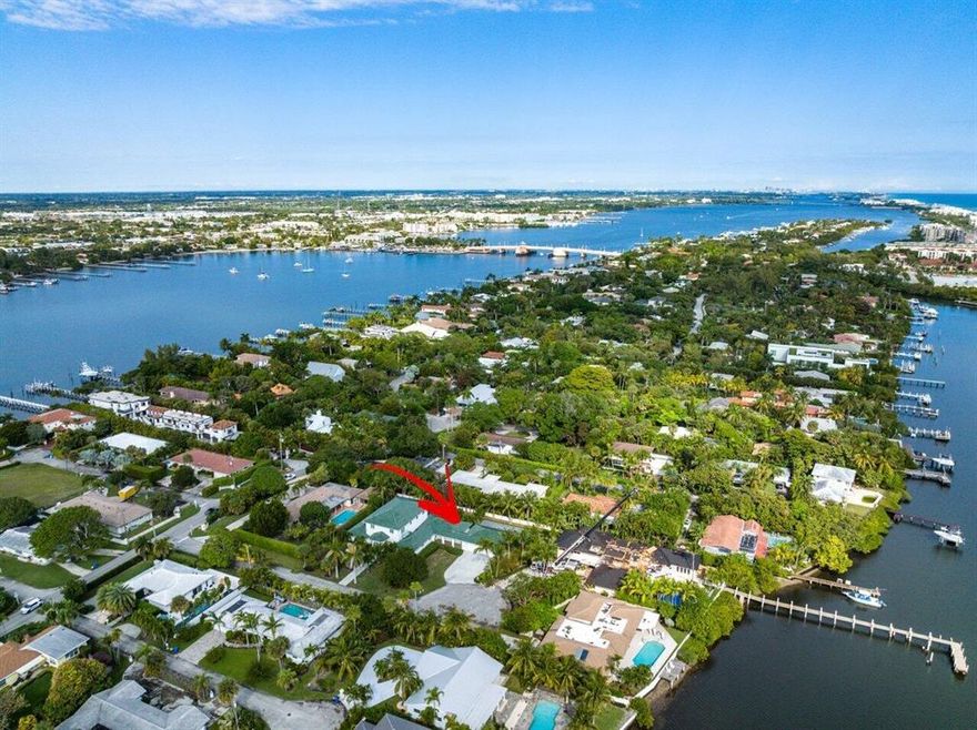 Discover your new lifestyle at this beautiful estate on 1/2 acre cul-de-sac lot. This home offers peaceful enjoyment located on Hypoluxo Island, part of the prestigious Manalapan-Hypoluxo community and walking distance to the beach. Double mahogany front doors, open to an elegant foyer with a grand spiral staircase leading to the second floor master suite with sitting area plus bonus room. The main living area offers a spacious open plan with with neutral colors and chic wood floors. Enjoy preparing feasts with ease in the generous eat in kitchen w/gas cooktop, temp controlled wine room plus there's a large island for extra countertop space. *see supplement.