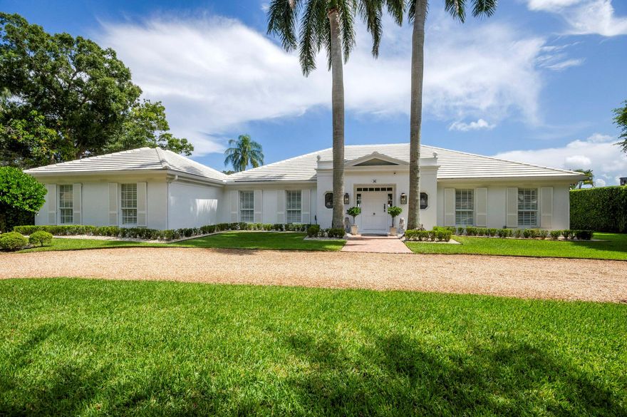 Welcome to your Palm Beach-inspired oasis in the heart of Tequesta's Heritage Oaks! This professionally designed 3-bedroom, 3-bathroom home embodies the essence of tropical luxury living. Nestled on a picturesque private lot with serene lake views, this property is a true gem. As you step inside, you'll be greeted by the timeless charm of tile floors that flow gracefully throughout the living spaces and bathrooms, complemented by the warmth of wood flooring in the bedrooms. Every inch of this home has been thoughtfully furnished with brand new pieces, ensuring an inviting and comfortable atmosphere for you and your guests. Natural light floods the living areas through large windows and sliders, offering captivating views of the tranquil lake and the lush, tropical backyard paradise.