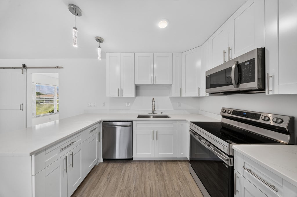 Photo of 216 W Arbor Avenue, Port Saint Lucie, FL 34952 (MLS # B26049376)
