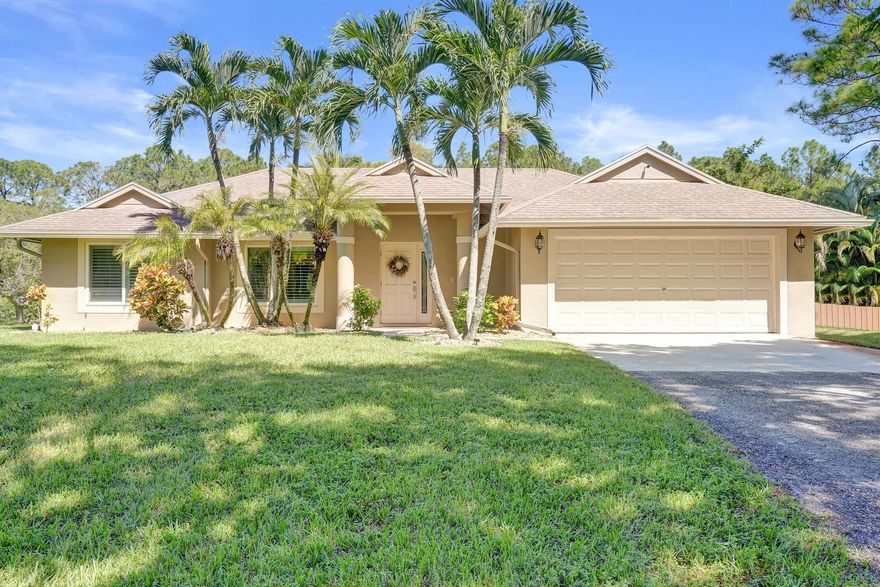 Welcome to your private paradise in the heart of Loxahatchee! This beautifully remodeled home sits on nearly 1.3 acres, offering the perfect blend of luxury, comfort, and outdoor living. The resort-style backyard is ideal for entertaining--featuring a sparkling pool, spacious tiki hut, screened patio, built-in fire pit, and horseshoe area for family fun. Inside, a stunning newly renovated kitchen with modern finishes opens to bright living spaces with high vaulted ceilings. Freshly updated bedrooms and baths include new flooring and stylish details throughout. The property is secured by an electric front gate, plus a second double-gated entry perfect for RVs, boats, or trailers. Experience the best of the Loxahatchee lifestyle in this truly exceptional retreat.