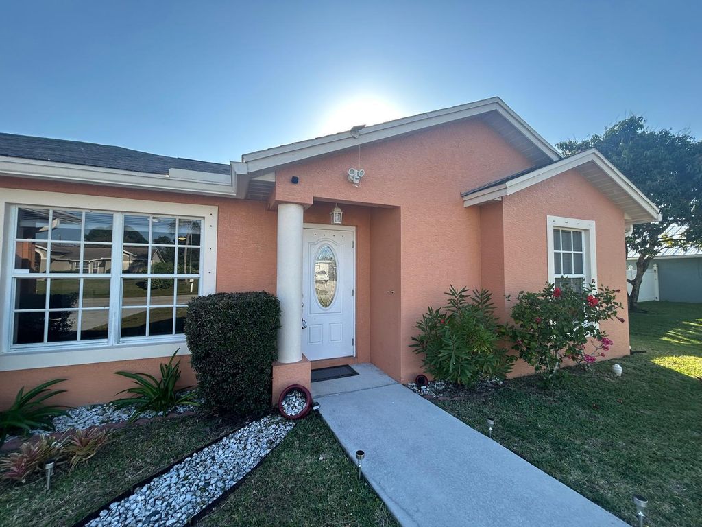 Photo of 2110 SW Larchmont Lane, Port Saint Lucie, FL 34984 (MLS # R11082222)