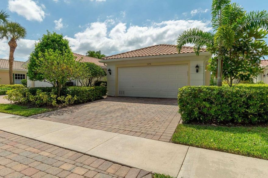 Priced to sell! Beautifully updated Capri model in VillageWalk of Wellington features 2 spacious bedrooms, 2 full baths, soaring ceilings, new bedroom flooring, fresh paint, and serene water views from the family-room with electric blinds. Enjoy walk-in closets, a covered patio, and garage storage. Additional updates include modernized fixtures and electric blinds in the bonus room which opens to serene water views, leading to a covered outdoor sitting area—perfect for relaxing or entertaining. Storage is plentiful with walk-in closets, mirrored closet doors, and built-in garage cabinetry. HOA dues include a truly all-inclusive resort-style lifestyle, with amenities such as: Two heated swimming pools, A scenic network of bridges and walking trails, On-site Italian restaurant serving breakfast, lunch, and dinner, Full-service salon, nail spa, and pet grooming center, Post office, convenience store, and library, Fitness center, tennis courts, and basketball, Cable, lawn care, pest control, and ADT-monitored security system, Regular exterior painting, landscaping, and power washing of common areas, 24/7 manned gate and roaming security, VillageWalk is a DiVosta-built, guard-gated master-planned community with 954 residences nestled across 478 lush acres. Residents enjoy over 6 miles of biking/jogging paths, 93 acres of parks, and 112 acres of scenic lakes and preserves—with 96% of homes located on a waterfront cul-de-sac lot. The heart of the community is the Town Center, a hub of recreation and convenience offering: Meeting rooms, card rooms, catering kitchen, and party rooms, Vibrant social calendar: bingo nights, water aerobics, bridge, holiday parties. Clubs and groups for all ages: Juliette club, bowling league, men who lunch, and family activities. Outdoor amenities: tennis, bocce, basketball, tot lot, fishing, kayaking, and picturesque gazebos. Conveniently located in East Wellington, VillageWalk is within walking distance to A-rated schools (Equestrian Trails Elementary, Emerald Cove Middle, and Palm Beach Central High) and just minutes from: Okeeheelee Park, The Mall at Wellington Green., Downtown West Palm Beach, CityPlace, and the Kravis Center., Palm Beach International Airport and world-class beaches. Equestrian enthusiasts will appreciate being just minutes from the Palm Beach International Equestrian Center (PBIEC), home of the Winter Equestrian Festival, as well as the Global Dressage Festival (GDF) and the International Polo Club (IPC). This exceptional home combines comfort, convenience, and luxury in a vibrant, amenity-rich community.