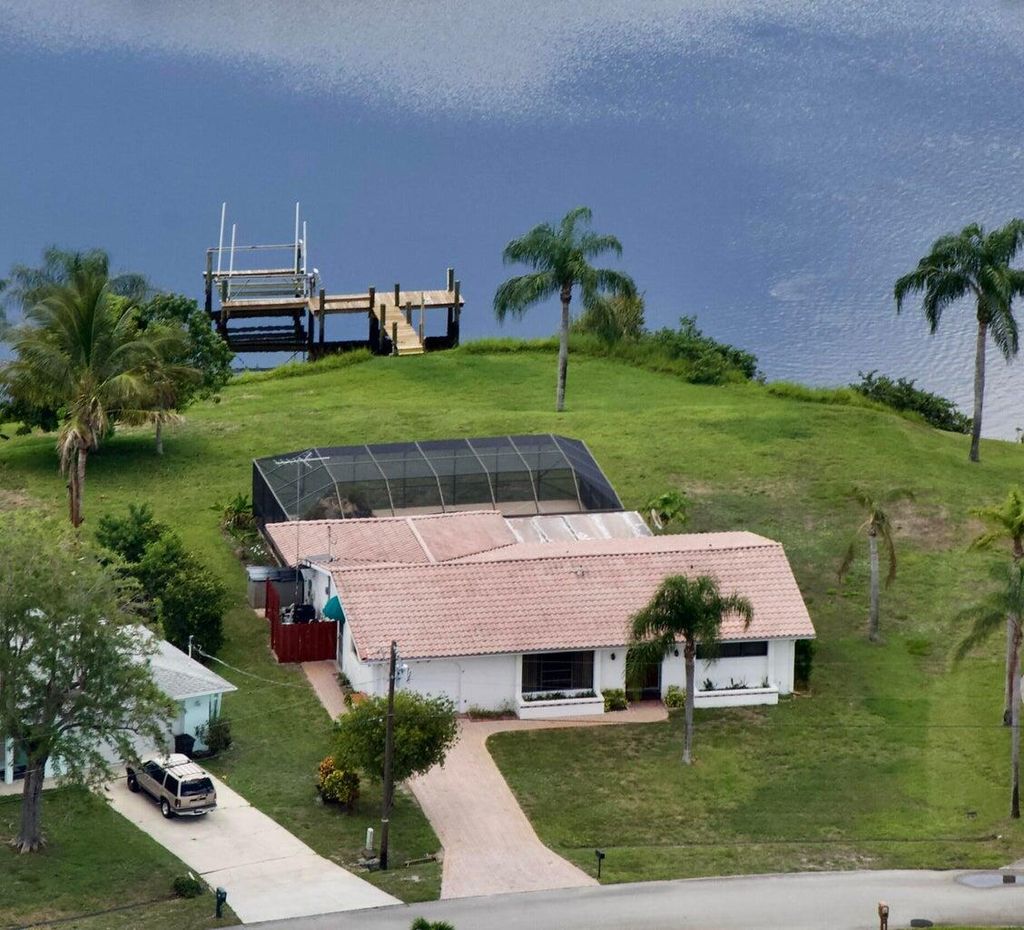 Photo of 1075 SE Coral Reef Street, Port Saint Lucie, FL 34983 (MLS # R11025176)