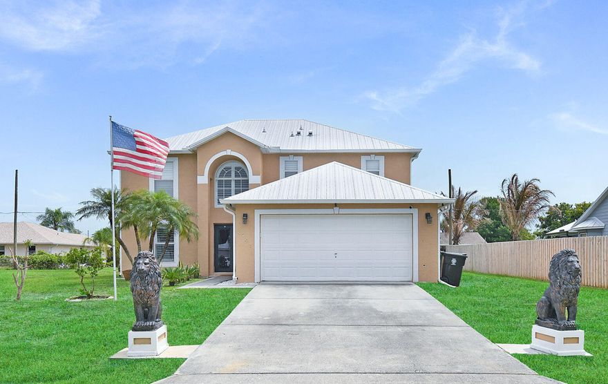 Welcome to this  2002 year built home  offering 4 bedrooms and 2.5 baths, designed with both comfort and functionality in mind.  A durable metal roof installed in 2020 adds long-term value and peace of mind.  The spacious 1st floor features  a large family room perfect for entertaining, along with a versatile media room that can easily serve as a home theater, playroom or office. Upstairs, you will find all 4 generously sized bedrooms, each complete with its own walk-in-closets, providing ample storage for everyone. Step outside to enjoy a sizeable backyard, ideal for gatherings or relaxation, along with an enclosed porch/patio area that extends your living space year -round. This home offers the perfect blend of space, flexibility and it is ready for you to make it your own.