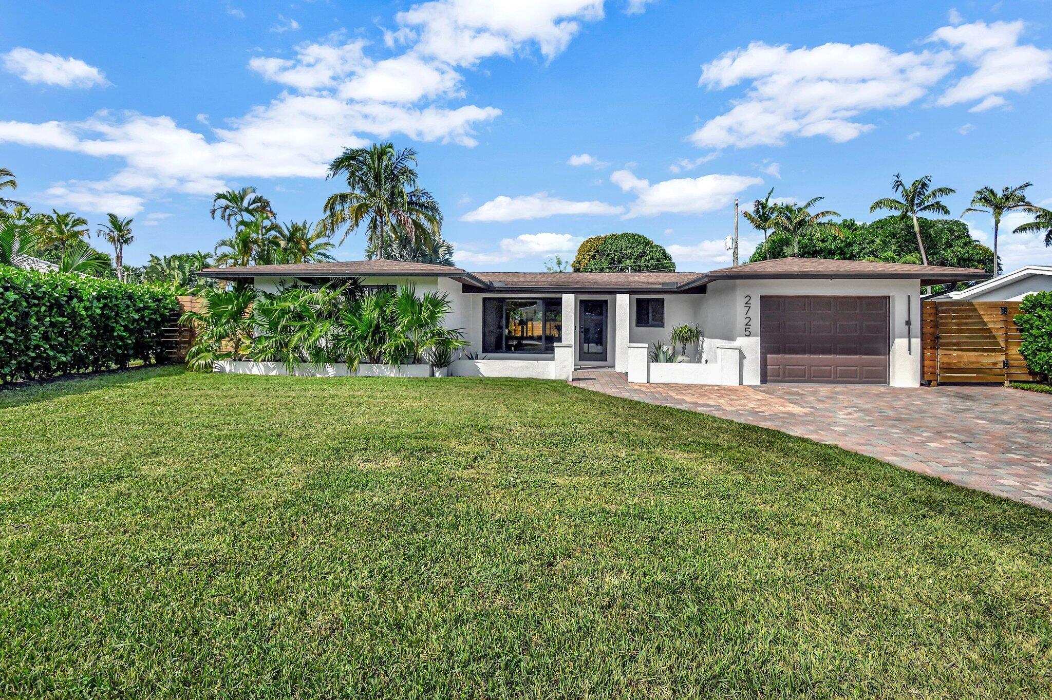 This brand-new custom renovation is an absolute oasis, featuring an open layout that seamlessly blends modern luxury with organic design. The heart of the home is a stunning kitchen with a 14-ft Quartzite island, complemented by top-of-the-line appliances. The space boasts a custom bar with a mini fridge and wine cooler. Custom Italian porcelain tile flooring flows throughout, enhancing the home's sleek, sophisticated aesthetic. High-end finishes and furniture are featured throughout adding elegance and comfort. This home offers more than just entertaining space - it also includes a private office, a garage under air, and a luxurious sauna and cold plunge. Outside, you'll find an expansive pergola, along with a large backyard creating the perfect blend of indoor-outdoor living