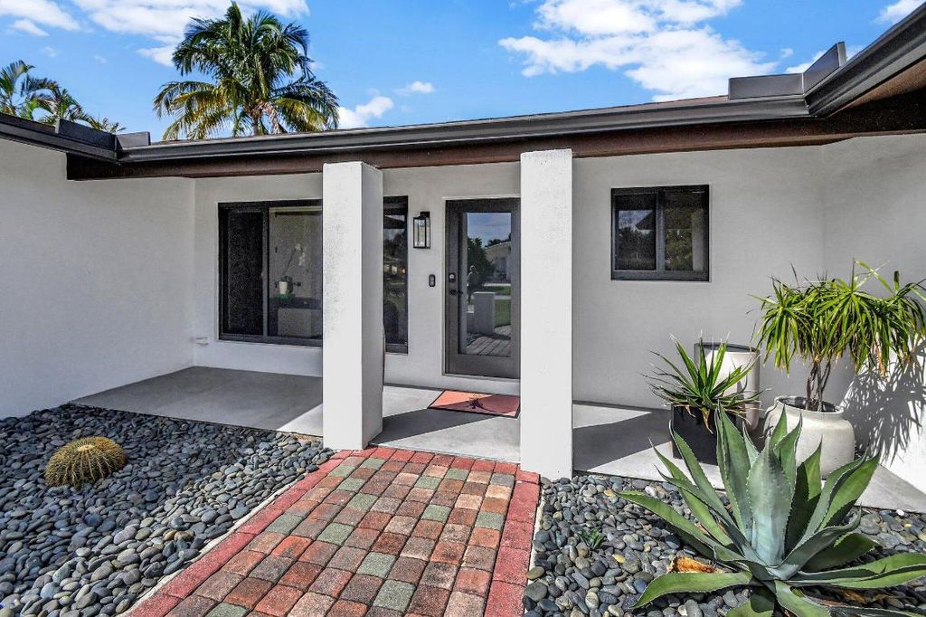 Photo of 2725 NE 2nd Court, Boca Raton, FL 33431 (MLS # R11028989)