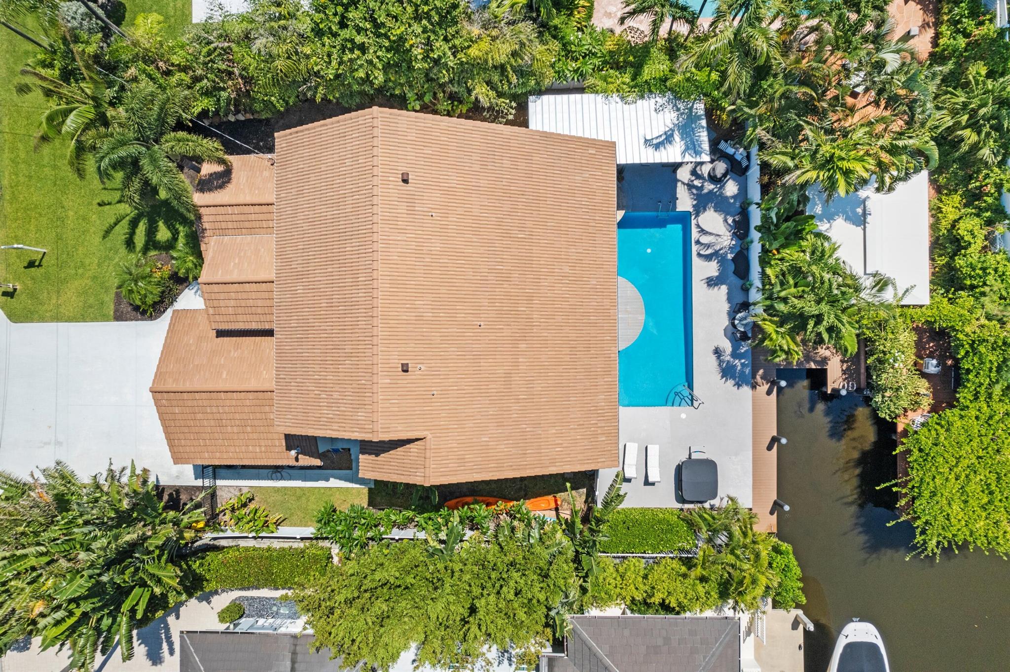 Experience the ultimate combination of luxury, comfort, and convenience with this dream waterfront property in Delray Beach. Perfectly situated just steps from the beach and near the dynamic Atlantic Avenue, this meticulously maintained 4 Bedroom, 3 Bath, 1 half bath home offers immense allure. Inside, discover two ground floor master suites outfitted with built-in walk-in closets, ensuring ample storage. The second floor adds two more bedrooms, providing plenty of space for everyone. Relax and entertain in the spacious living room and den or enjoy the Florida sunshine in the heated pool and hot tub. The eat-in kitchen features floor-to-ceiling impact windows that frame stunning views of the tranquil waterway.Highlights of this exceptional property include: