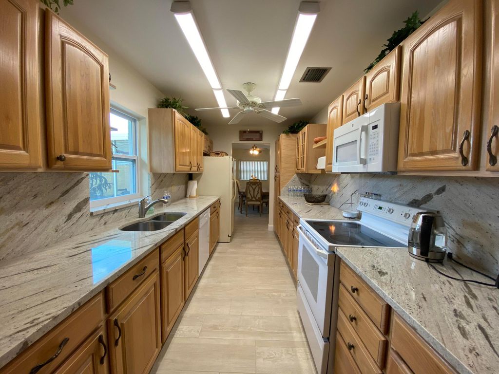 Photo of 1403 W Libby Drive, West Palm Beach, FL 33406 (MLS # R11062986)