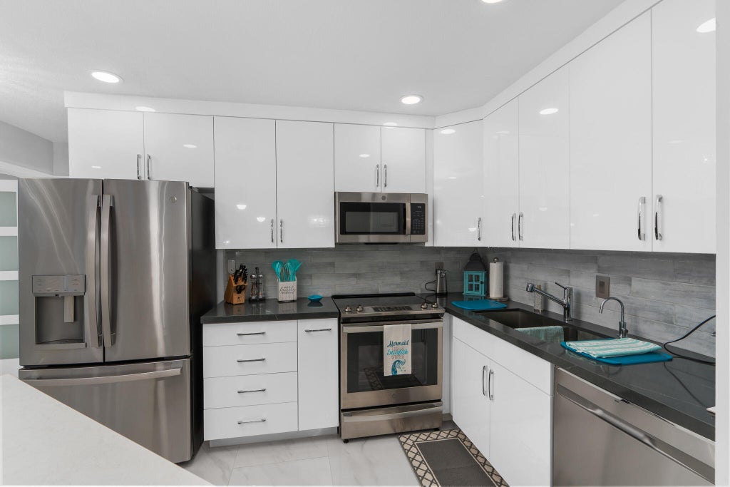 Photo of 130 CYPRESS CLUB Drive #306, Pompano Beach, FL 33060 (MLS # B26064235)