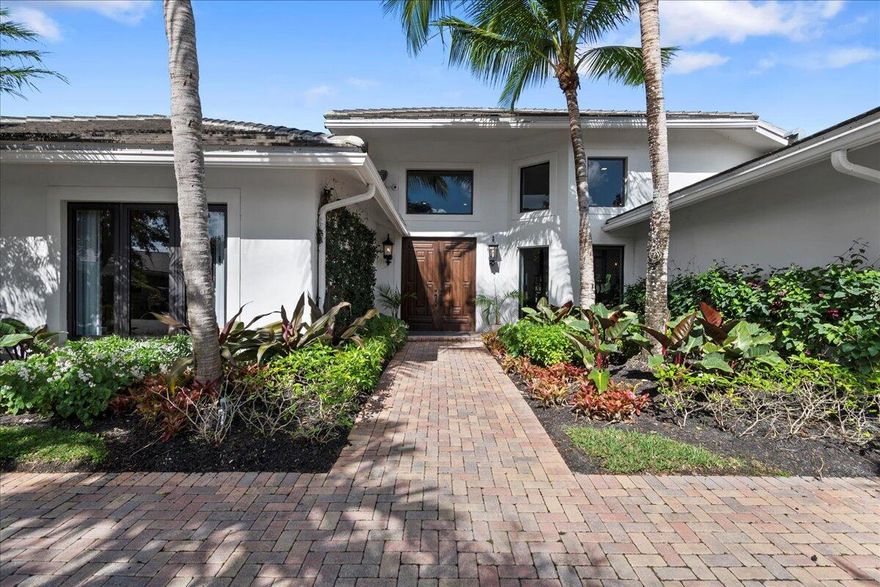 Welcome to a refined and exquisitely renovated (2023) residence within the prestigious Palm Beach Polo and Country Club. Situated on a thoughtfully designed coveted lot, this home offers an intimate and low-maintenance setting, perfect for those seeking private luxury. The property seamlessly blends modern design with timeless elegance. Step into the heart of the home, where a gourmet chef's kitchen awaits, complete with state-of-the-art appliances, custom cabinetry, and an expansive island - the perfect setting for culinary enthusiasts and hosting gatherings. The open floor plan flows effortlessly into the inviting living spaces, adorned with exquisite finishes and showcasing panoramic views of the lush surroundings.