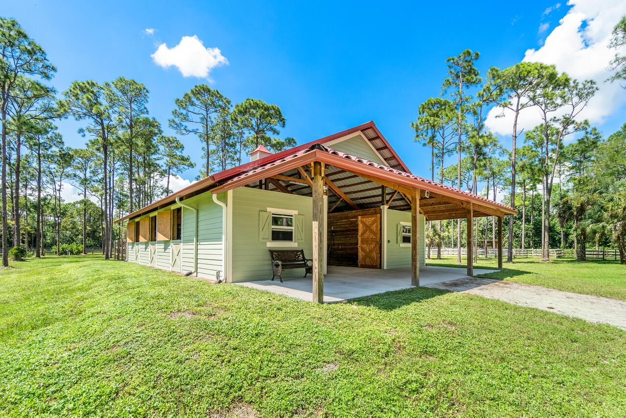 Experience premier equestrian living on this 5-acre horse farm, just minutes from Wellington's world-class showgrounds. Horses will enjoy lush pastures, and you'll benefit from a turnkey setup designed for comfort and convenience.The center-aisle barn offers 6 stalls, a feed room, tack room, and wash racks. Four stalls are available at $750 per dry stall, with electric and water included.Additional features:Five paddocks for rotation and turnoutNew irrigated fiber ring (200x100) with excellent footingTractor access for easy ring maintenanceBeautiful RV available for $2,000/monthTenant responsible for manure removal.