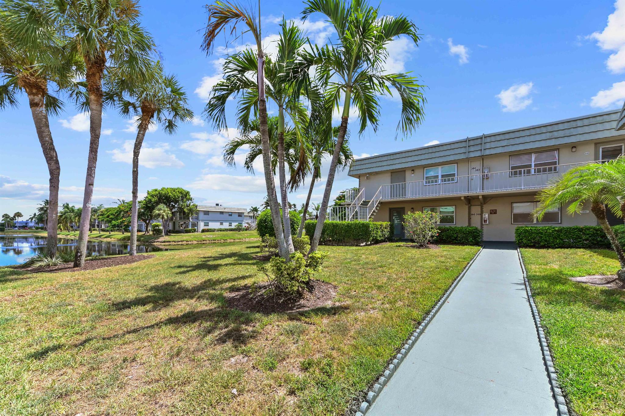Exuding timeless appeal, this two-bedroom, two-bathroom, second-floor condominium is an absolute gem, located within the prestigious Kings Point Community in Delray Beach, Florida. Constructed to ensure comfort and practicality, the residence emanates a refreshing ambience. The charming interiors are thoughtfully designed, featuring a cohesive blend of updated kitchen and baths. The kitchen features white cabinets, stainless steel appliances, and granite counter tops. The outside view from this residence offers a tranquil visage of crystalline water bodies, thriving with nature's bounty. The residence also features a screen enclosed outdoor space, perfect for enjoying the spectacular water view.