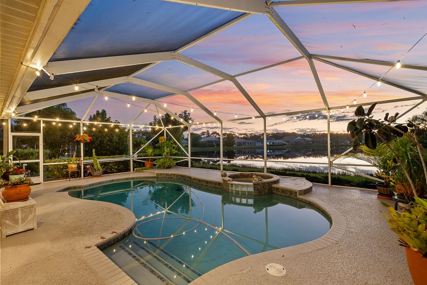 Significant $25,000 Price Improvement. Extensively updated and truly move-in ready, this lakefront pool home has high ceilings and abundant natural light, a renovated kitchen, modern bathrooms, and designer wood-look plank flooring throughout. A flexible bonus space easily functions as a home office, den, or media room, etc. Outdoors, the expansive covered lanai with pool and spa overlooks wide lake views and spectacular sunsets delivering the Florida lifestyle. Located within a gated, tree-lined golf club community close to shopping and dining, this home offers updates, setting, and value in one complete package.