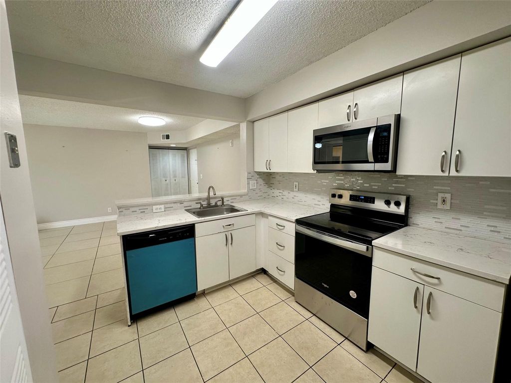 Photo of 5701 Riverside Drive #205, Pompano Beach, FL 33067 (MLS # F10505010)