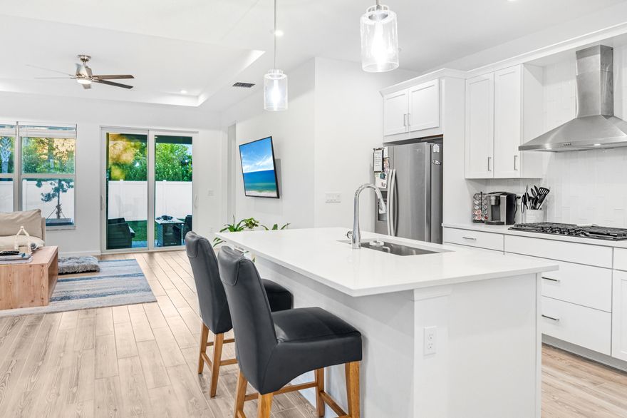 Priced to sell this week. Like-new 2022 home in Tradition.  This stunning 2-bedroom, 2-bathroom home with flex room offers the perfect blend of comfort and luxury in the highly desirable Emery neighborhood of Tradition. This Aspen model by Mattamy Homes features ALL available luxury upgrades.  Step inside to discover vaulted ceilings throughout the living areas and primary bedroom. The gourmet kitchen showcases elegant white shaker cabinets with quartz countertops, stainless steel appliances including a gas stovetop, built-in oven, microwave, dishwasher, and refrigerator. You'll love the walk-in pantry and convenient storage options throughout. The spacious primary bedroom includes an oversized walk-in closet and connects to a luxurious bathroom featuring a walk-in spa shower with upgraded fixtures. Both bathrooms boast beautiful quartz countertops and premium Moen fixtures. Additional features include a versatile bonus room perfect for an office, nursery, or third bedroom, hurricane-resistant glass windows allowing abundant natural light, smart home thermostat, and EV charging wiring. The home comes complete with top-of-the-line LG washer and dryer. Outside, enjoy your private fenced backyard with paver patio, perfect for entertaining. The home's location is just 5 minutes from downtown, steps away from the NEW Tradition park, top schools, and offers access to the community tram system.