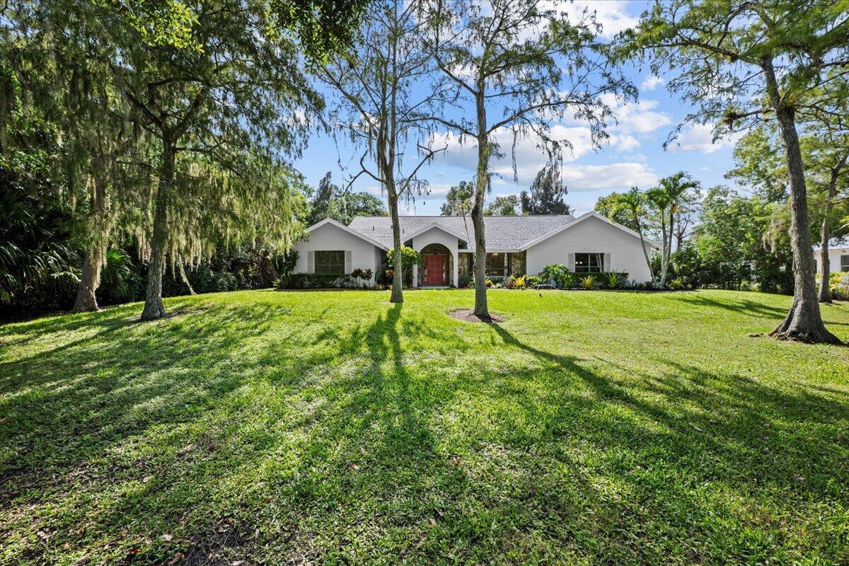 Beautifully Renovated 3 Bedroom + Den Pool Home in Palm Beach Country Estates This beautifully updated 3-bedroom, 2.5-bath home with a den, 2-car garage, and additional shed storage is ideally located on a large lot with no HOA--perfect for bringing all your toys, boats, RVs, or equipment. Located in highly sought-after Palm Beach Country Estates, this property offers space, freedom, and flexibility. Featuring a brand new roof and a 2020 A/C system, this home provides lasting value and peace of mind. Inside, you'll love the light and airy open floor plan with a split bedroom layout, offering both privacy and functionality. Freshly painted inside and out, the home features new luxury vinyl wood flooring throughout.The stunning new kitchen boasts all-new cabinetry, quartz