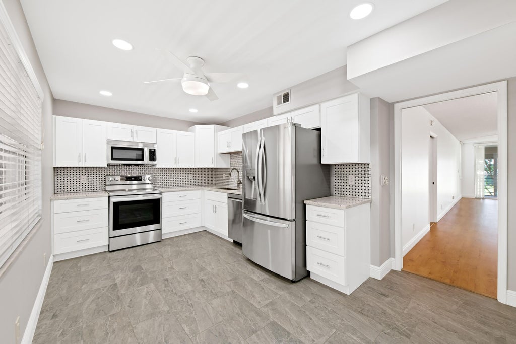 Photo of 800 Cypress Grove Drive #211, Pompano Beach, FL 33069 (MLS # B26040109)
