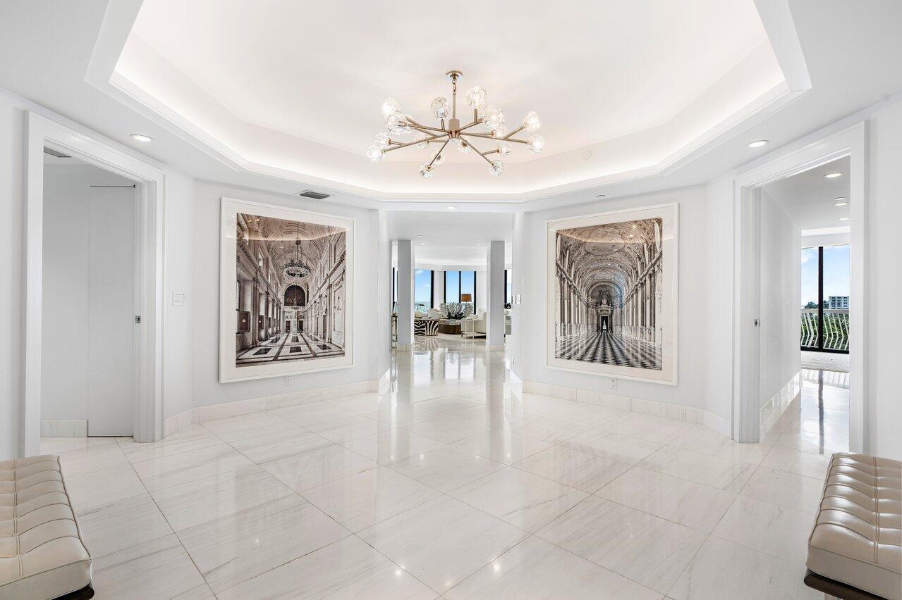 ''The world is your oyster.'' This rare, stunning, high floor, fully renovated, Southeast corner residence with unobstructed panoramic views is a prized jewel of the prestigious Sloan's Curve 2100 Building. The home exudes sophistication, serenity and quality. The elegant, light-filled corner unit has 3 Bedrooms + Den & 3.5 bath home with incomparable views of the Atlantic ocean, Phipps Ocean Park and the Intracoastal waterway. Experience morning sunrises over the ocean and evening sunsets over the Intracoastal with sunlight throughout the day. This unit offers an uncommon opportunity to experience the best of Palm Beach oceanfront turn-key living. The interior renovation includes Dolomiti marble flooring, Calcutta marble vanities and top of the line fixtures. Floor to ceiling impact