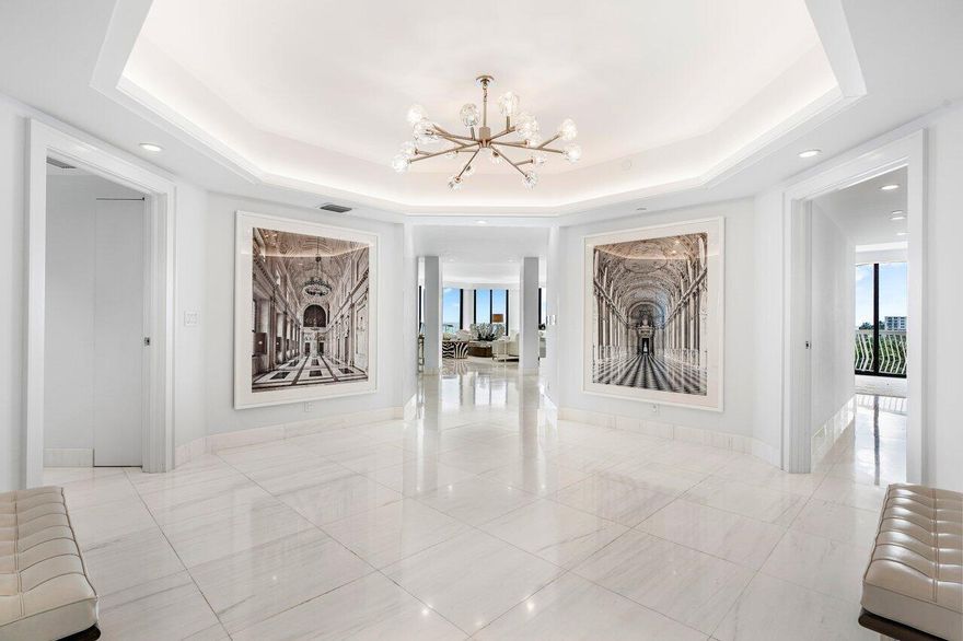 ''The world is your oyster.''  This rare, stunning, high floor, fully renovated, Southeast corner residence with unobstructed panoramic views is a  prized jewel of the prestigious Sloan's Curve 2100 Building. The home exudes sophistication, serenity and quality. The elegant, light-filled corner unit has 3 Bedrooms + Den & 3.5 bath home with incomparable views of the Atlantic ocean, Phipps Ocean Park and the Intracoastal waterway.  Experience morning sunrises over the ocean and evening sunsets over the Intracoastal with sunlight throughout the day. This  unit offers an uncommon opportunity to experience the best of Palm Beach oceanfront turn-key living. The interior renovation includes Dolomiti marble flooring, Calcutta marble vanities and top of the line fixtures.  Floor to ceiling impact